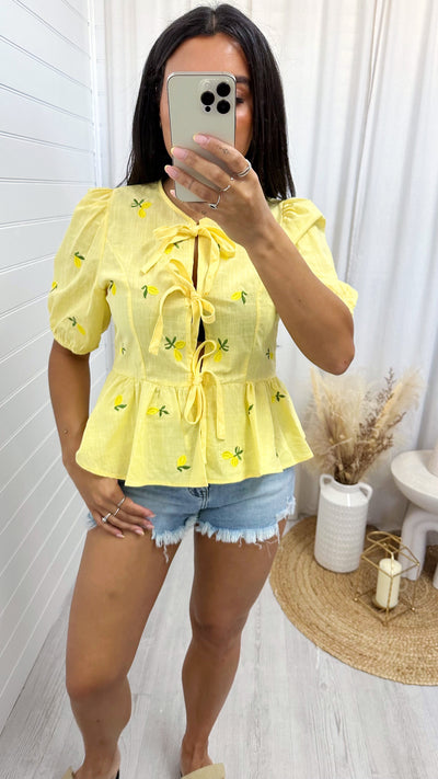 Lemon Embroidered Peplum Tie Front Top - LEMON